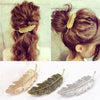 barrette plume cheveux